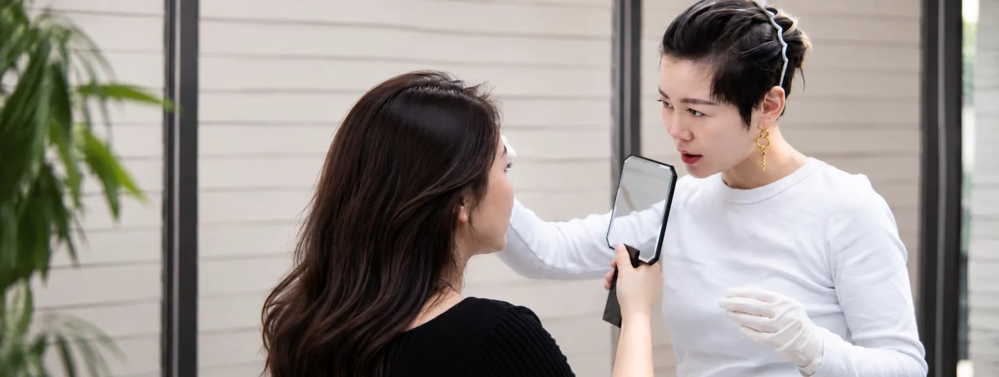 Lina Liu discussing brow design with a client